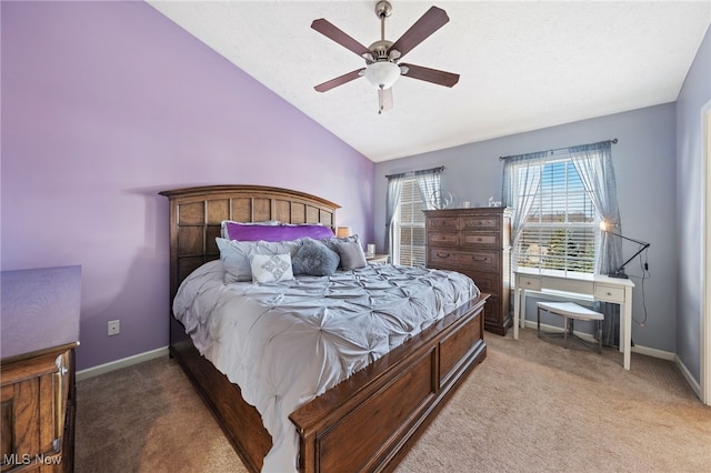 bedroom with baseboards, light carpet, ceiling fan, and lofted ceiling