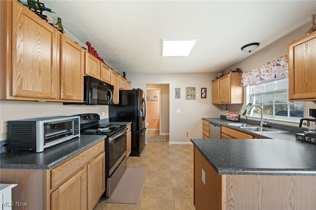 kitchen with electric range, black microwave, dishwasher, a toaster, and a sink