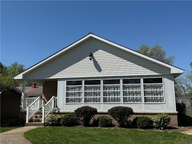 1423 N Wooster Ave, Dover, OH 44622 - view of front of house featuring a porch and brick siding