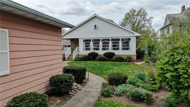 1423 N Wooster Ave, Dover, OH 44622 - rear view of house with a lawn