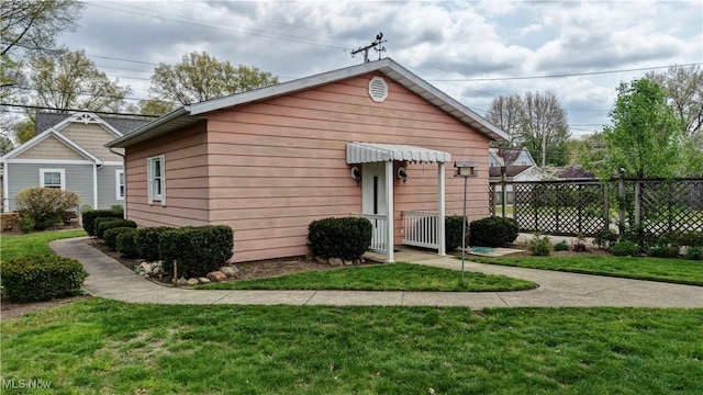 1423 N Wooster Ave, Dover, OH 44622 - view of front of home featuring fence and a front yard