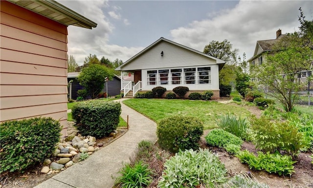 1423 N Wooster Ave, Dover, OH 44622 - rear view of house featuring a yard and fence