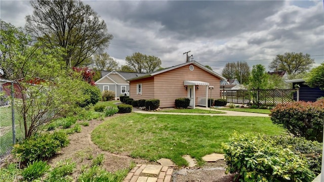 1423 N Wooster Ave, Dover, OH 44622 - exterior space featuring a lawn and fence
