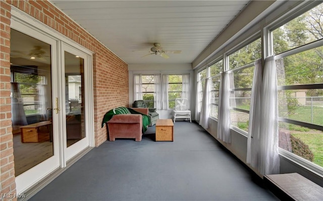 1423 N Wooster Ave, Dover, OH 44622 - sunroom / solarium with a ceiling fan, brick wall, concrete floors, and french doors