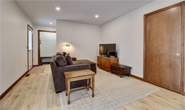 1423 N Wooster Ave, Dover, OH 44622 - living room with recessed lighting, baseboards, and light wood-style flooring