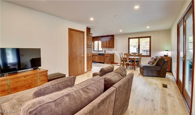 1423 N Wooster Ave, Dover, OH 44622 - living area with recessed lighting, light wood-style flooring, and visible vents