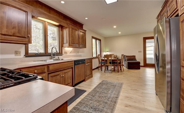 1423 N Wooster Ave, Dover, OH 44622 - kitchen with freestanding refrigerator, recessed lighting, paneled dishwasher, and a sink
