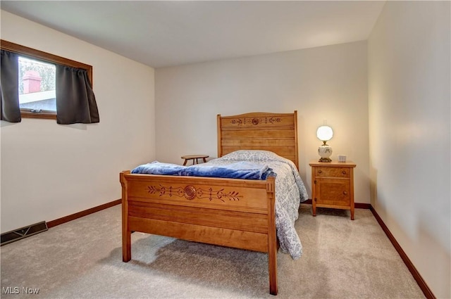 1423 N Wooster Ave, Dover, OH 44622 - carpeted bedroom featuring visible vents and baseboards