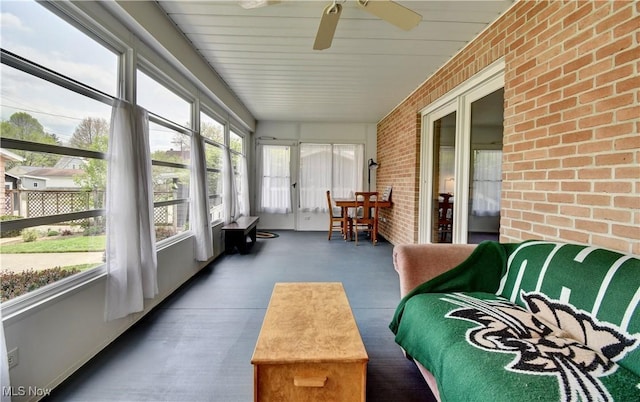 1423 N Wooster Ave, Dover, OH 44622 - sunroom featuring a healthy amount of sunlight, a ceiling fan, and brick wall