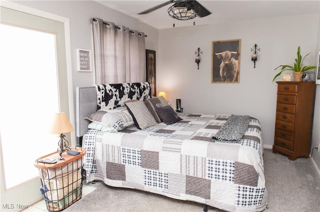 bedroom with carpet floors and baseboards