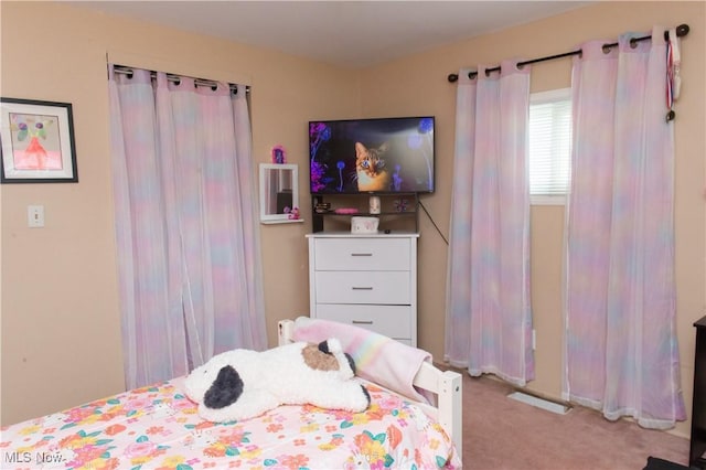 bedroom with light carpet
