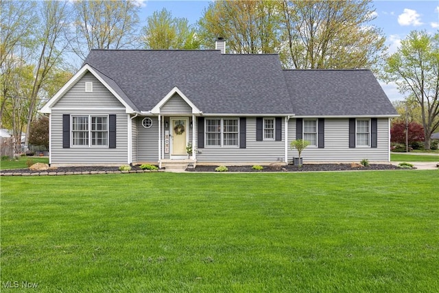 ranch-style house with a shingled roof, a chimney, and a front yard