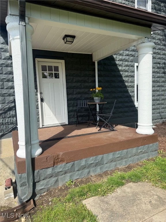 doorway to property with a porch