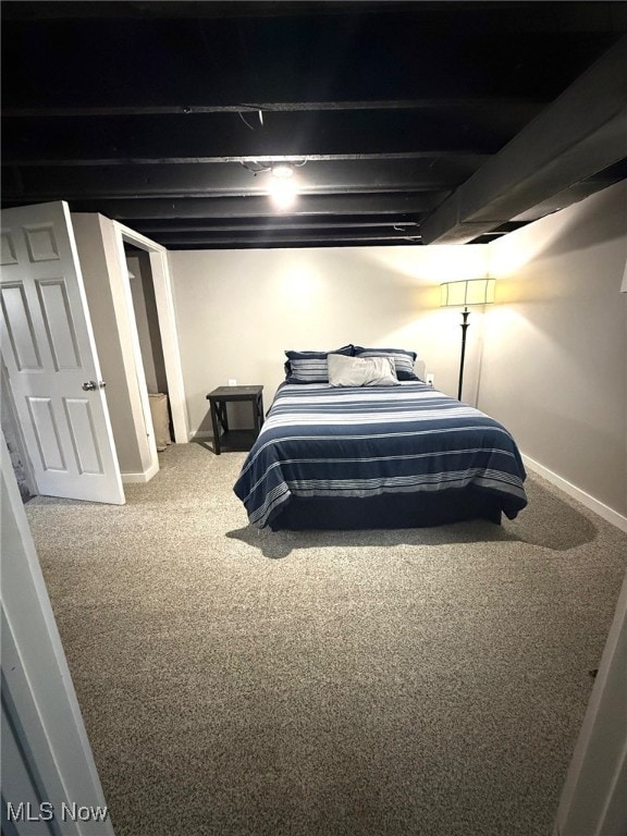 carpeted bedroom featuring baseboards