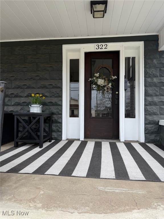 entrance to property with stone siding