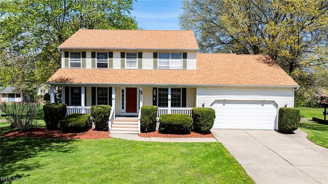 view of front of house with a garage, a front lawn, a shingled roof, a porch, and driveway