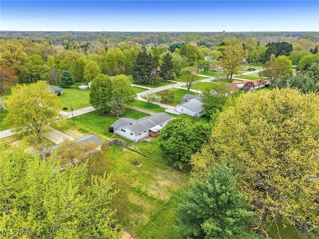 drone / aerial view featuring a view of trees