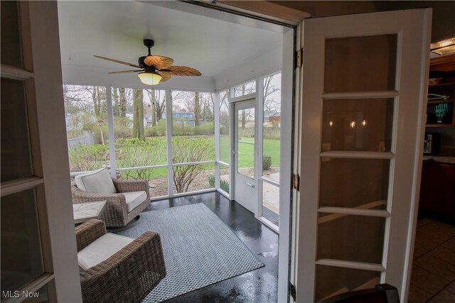 sunroom / solarium with ceiling fan