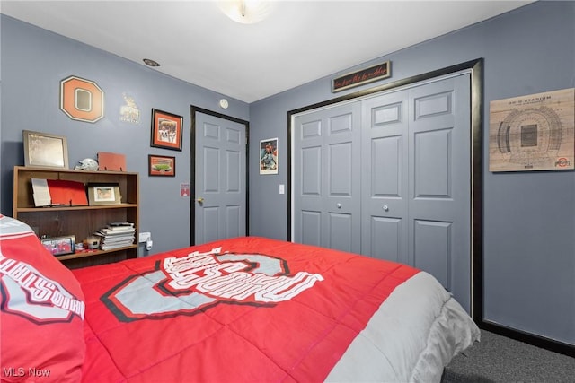 carpeted bedroom with a closet