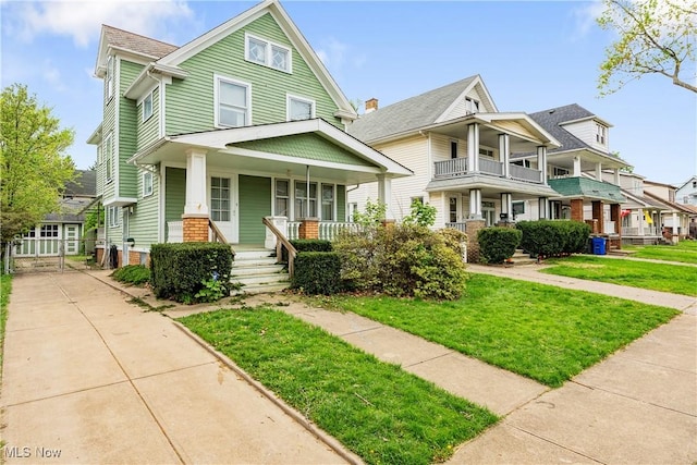 view of front facade with a porch and a front yard