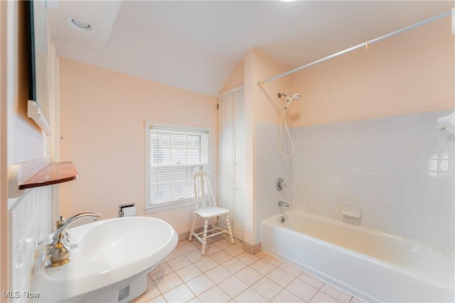 bathroom featuring tile patterned floors, vaulted ceiling, and shower / tub combination