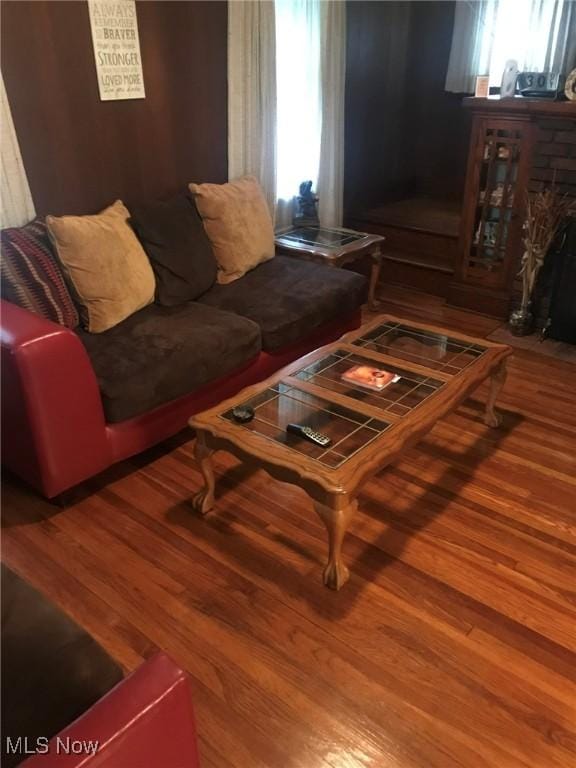 720 Kipling St, Akron, OH 44306 - living room with wood finished floors, plenty of natural light, and a stone fireplace