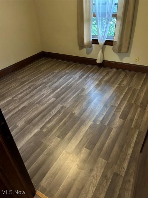 720 Kipling St, Akron, OH 44306 - spare room with baseboards and dark wood finished floors