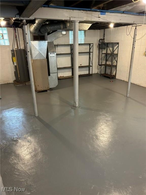 720 Kipling St, Akron, OH 44306 - basement with water heater, concrete block wall, and heating unit