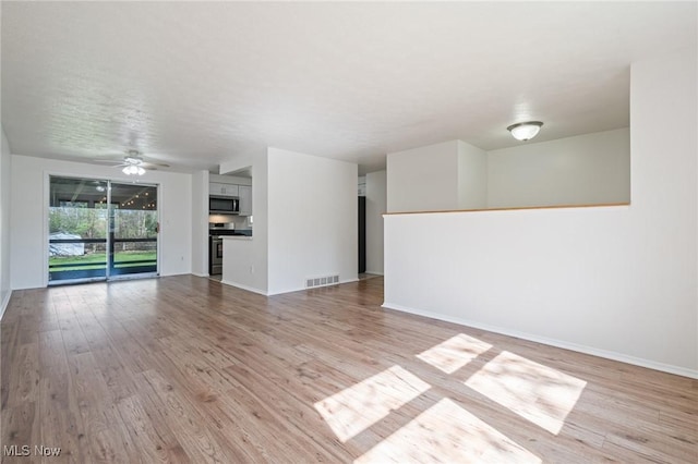 6414 Glenallen Ave, Solon, OH 44139 - empty room featuring light wood finished floors, baseboards, and a ceiling fan