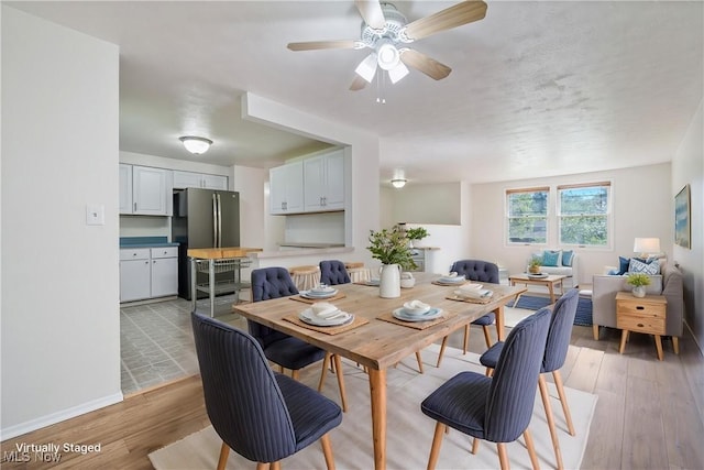 6414 Glenallen Ave, Solon, OH 44139 - dining space featuring light wood-style floors, a ceiling fan, and baseboards
