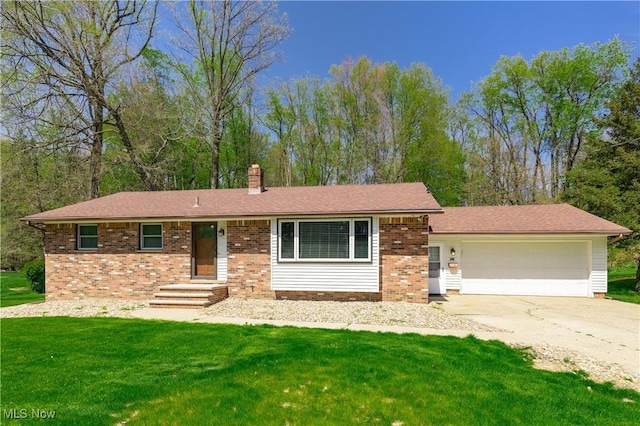 single story home featuring a garage, a front yard, a chimney, brick siding, and concrete driveway