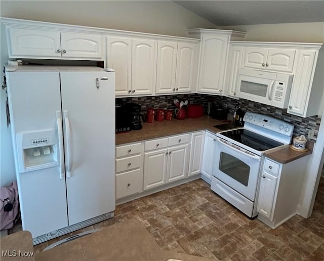 608 Chardonnay Cir, Vermilion, OH 44089 - kitchen featuring white appliances, decorative backsplash, white cabinets, dark countertops, and vaulted ceiling