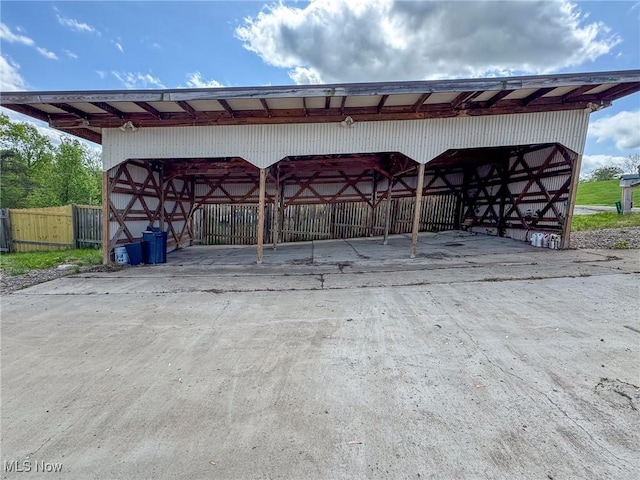 view of parking / parking lot with fence