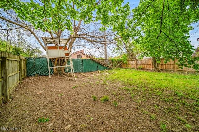 view of yard with a fenced backyard