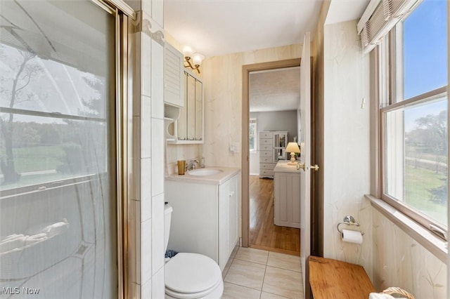 full bathroom featuring vanity, tile patterned flooring, and toilet