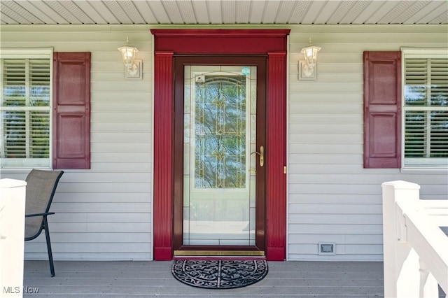 doorway to property featuring a porch