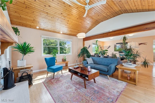 living area with wood ceiling, a wood stove, vaulted ceiling, baseboards, and light wood finished floors