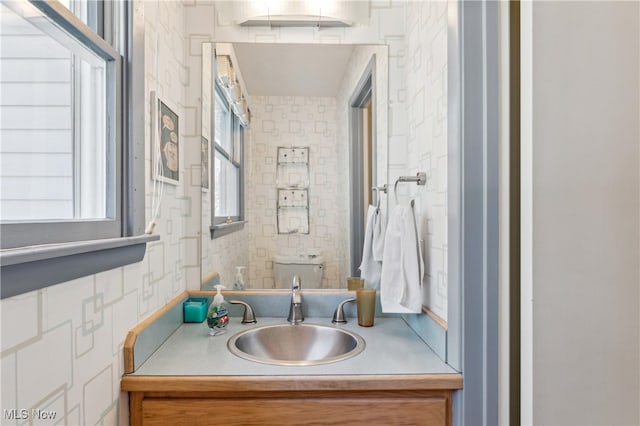 bathroom featuring vanity and toilet