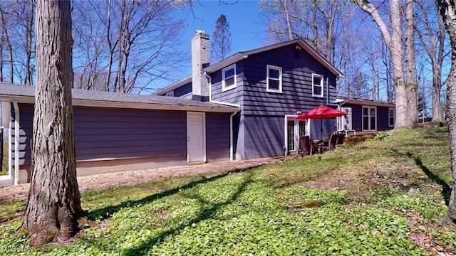 431 Somerset Dr, Chagrin Falls, OH 44022 - rear view of property with a chimney