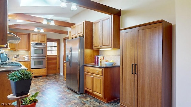 431 Somerset Dr, Chagrin Falls, OH 44022 - kitchen featuring brown cabinetry, decorative backsplash, dark countertops, ventilation hood, and appliances with stainless steel finishes