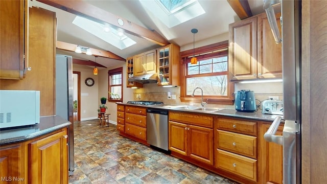 431 Somerset Dr, Chagrin Falls, OH 44022 - kitchen with brown cabinets, stainless steel appliances, a sink, and lofted ceiling with skylight