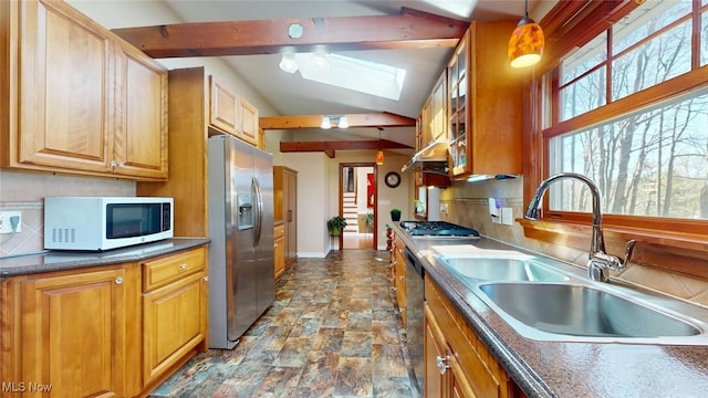 431 Somerset Dr, Chagrin Falls, OH 44022 - kitchen featuring dark countertops, a sink, stone finish flooring, a skylight, and stainless steel appliances
