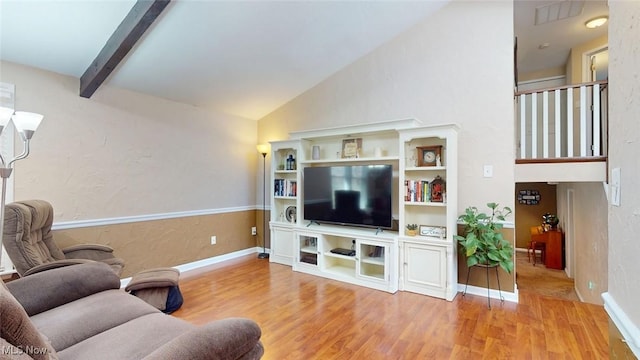 431 Somerset Dr, Chagrin Falls, OH 44022 - living room featuring baseboards, visible vents, vaulted ceiling with beams, and wood finished floors