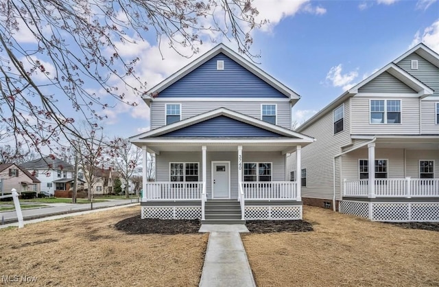 american foursquare style home featuring a porch
