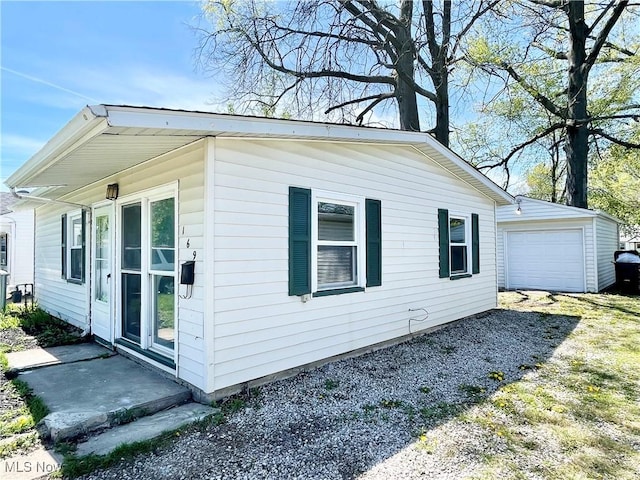 view of property exterior with driveway