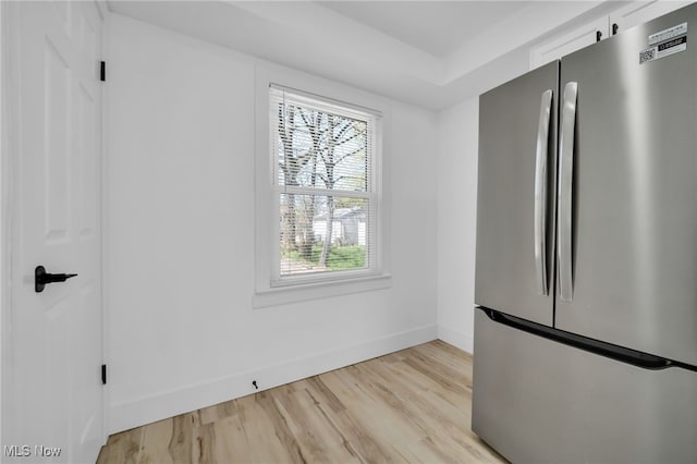 4392 E 144th St, Cleveland, OH 44128 - unfurnished dining area with baseboards and light wood finished floors
