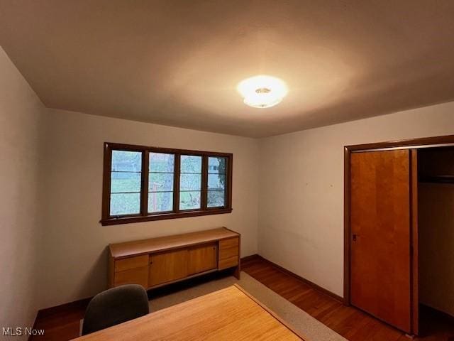 bedroom with a closet and light wood finished floors