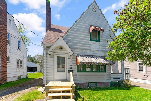 view of front facade with a chimney