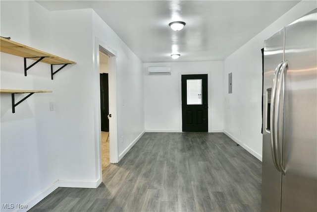 1553 Parkman Rd NW, Warren, OH 44485 - foyer featuring baseboards, a wall mounted AC, electric panel, and wood finished floors