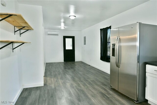 1553 Parkman Rd NW, Warren, OH 44485 - entrance foyer with baseboards, dark wood finished floors, electric panel, and a wall mounted air conditioner